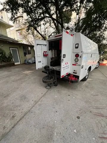 Magnet Plumbing service vehicle on-site for Grease Trap Cleaning in Key Biscayne